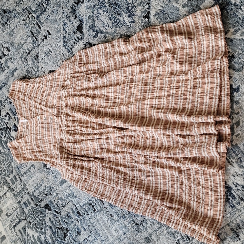 Free People baby doll dress, size M, could fit L & XL. Color is white and bronze